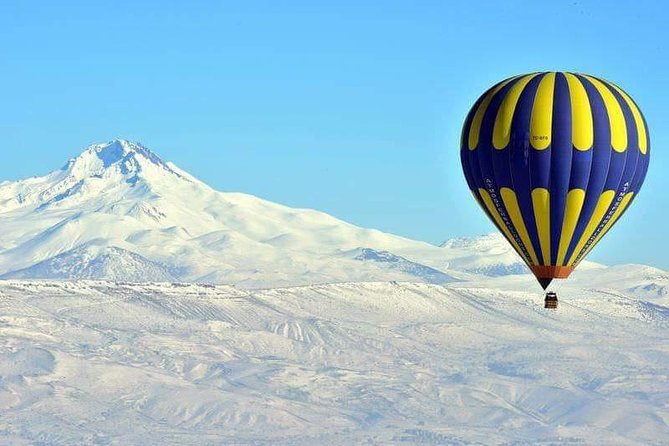 Cappadocia Hot Air Balloon Ride with Transfers - The Fairy Chimney Inn and a cave-town setting