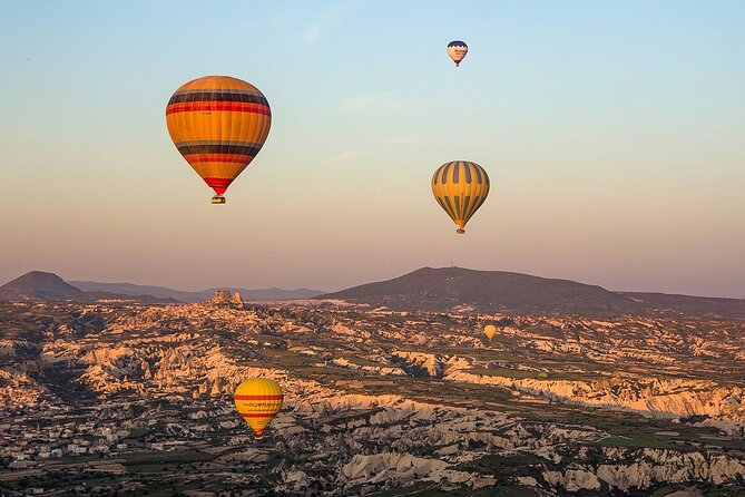 Cappadocia Hot Air Balloon Tour Over Fairychimneys - Coffee, pastry, and balloons coming alive