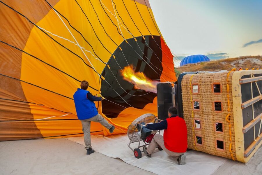 Cappadocia: Sunrise Hot Air Balloon, Göreme & Fairy Chimneys - Fairy chimneys, caves, and the sunrise below