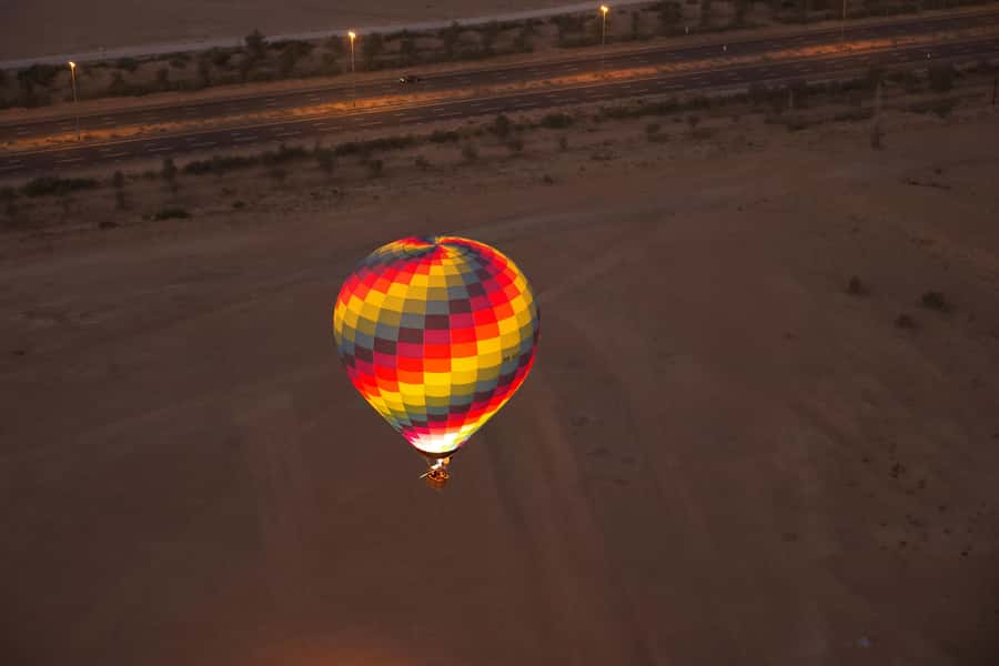 Dubai: Hot Air Balloon Ride & Falcon Show Over the Desert - Floating above the desert at sunrise
