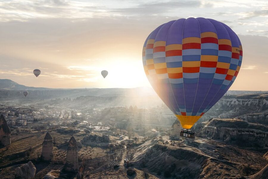 Hot air balloons in Goreme red valley - The small-group format and pilot-led celebration