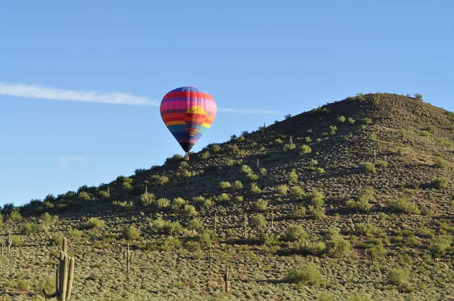 Phoenix: Sunrise Hot Air Balloon Tour - Sunrise Above Cacti and Mountains