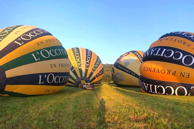 Provence Hot-Air Balloon Ride from Forcalquier - Landing, helping with the balloon, and raising a glass