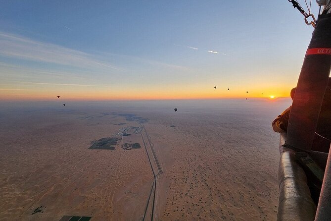 Sunrise Hot Air Balloon Tour over Dubai Desert - Watching the balloon rise from the sand